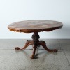 An Antique Burr Dining Table