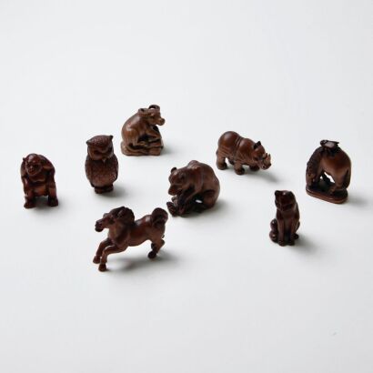 A Collection Of Eight Small Hand Carved Wooden Animal Figures