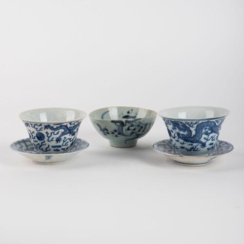 A Set of Two Chinese Qing Dynasty Blue and White Dragon Cups AND A Set of Two Blue and White Saucers AND A Blue and White Dragon Cup