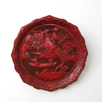 A Chinese Carved Red Lacquer ' Figures in a Landscape' Dish