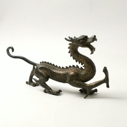 A Chinese Cast Bronze Dragon Ornament