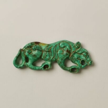 A Chinese Aged Turquoise Carving of a Tiger Pendant