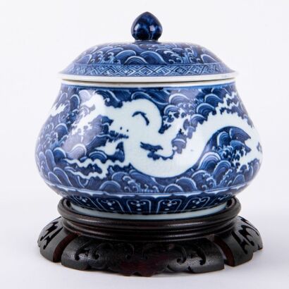 A Chinese Blue and White Dragon and Wave Lidded Jar