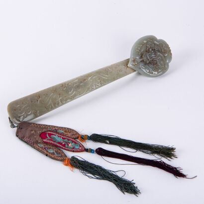 A Chinese Late Qing Dynasty Celadon Jade Ruyi Scepter