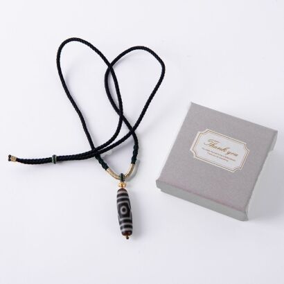 A Chinese Tibetan Three-eyed Dzi Bead