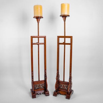 A Pair of Chinese Carved Ju Wood Lamp Stands with Candles