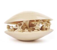 A Chinese/Japanese Carved Ivory "Clams Dream"