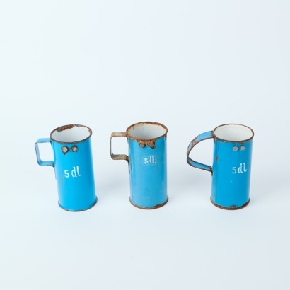A Set of Three Enamel Measuring Cups