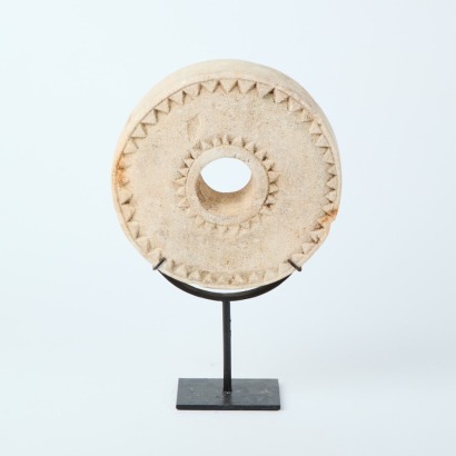 A Decorative Oba Stone Wheel