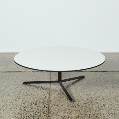 A Circular Eames Style Table with a Metal Star Base
