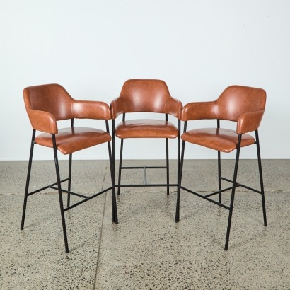 A Set of Three Copper Bar Stools