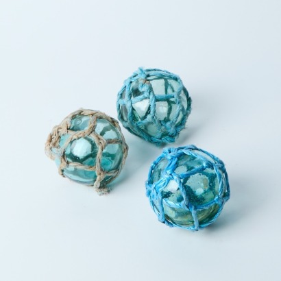 A Trio of Vintage Japanese Glass Fishing Floats with Glass Seals