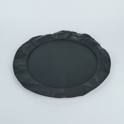 An Alessi Foix Round Metal Serving Tray in Black