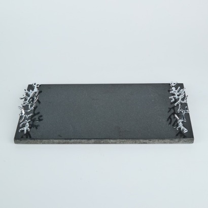 A Mukul Goyal Handcrafted Cheese Board with Chromed Brass and Black Granite