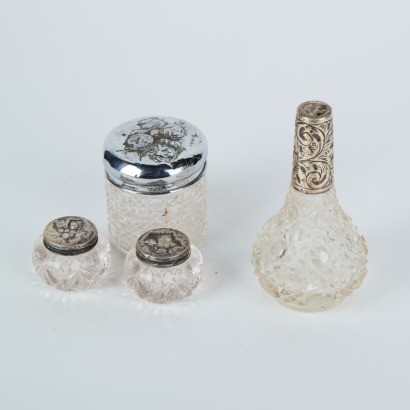 A Set of Four Sterling Silver Topped Containers
