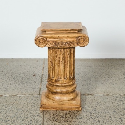 A Scroll Topped Column