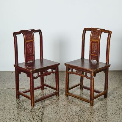 A Set of Two Chinese Aged Wood Chairs with Figural Motif