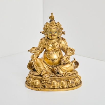 A Gilt Jambhala Figure, Tibet