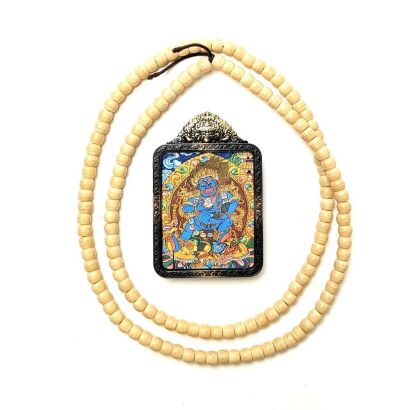A Chinese Tibetan Painted Image of Black Jambhala with a Bronze Box and Bead Necklace