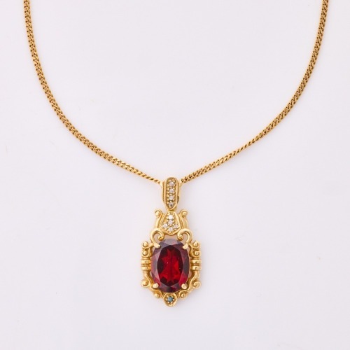 9ct Yellow Gold, Oval Mixed Cut Garnet on 45cm Curb Link Necklace