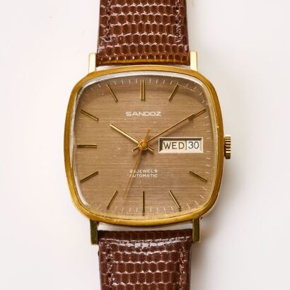 Gold Plated, 33mm Sandoz Rounded Square Day-Date Automatic Wristwatch, circa 1970's