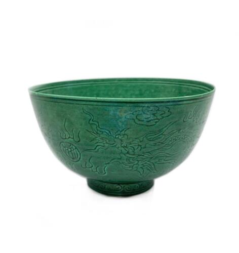 A Chinese Qing Dynasty Green-glazed Incised 'Dragon' Bowl (Da Qing Qianlong Nian Zhi Mark)