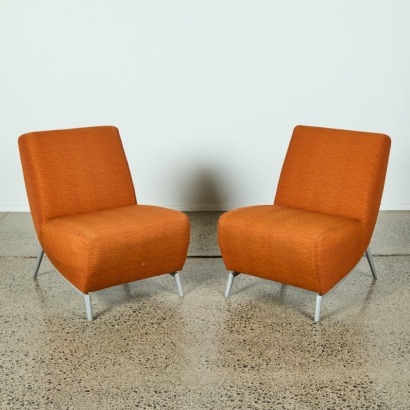 A Pair of Orange Mid-Century Style Chairs