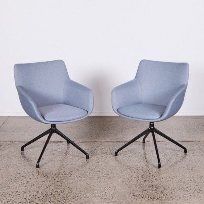 A Pair of Svelte Swivel Chairs