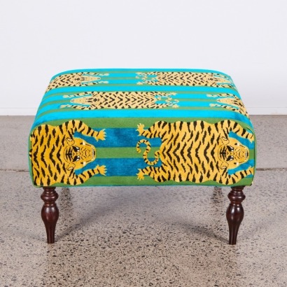 A Schumacher Kokhang Tiger Velvet Upholstered Ottoman