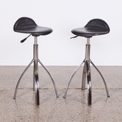 A Pair of Modern Adjustable and Swiveling Stools