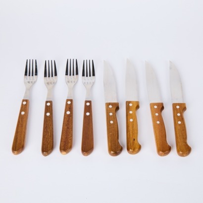 A Set of Four Large Steak Knives and Forks with Wooden Handles