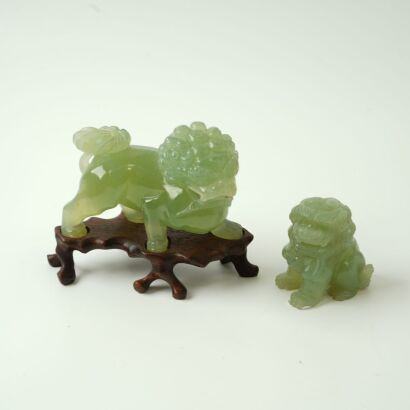 A Set of Two Chinese Green Jade Lion Carvings