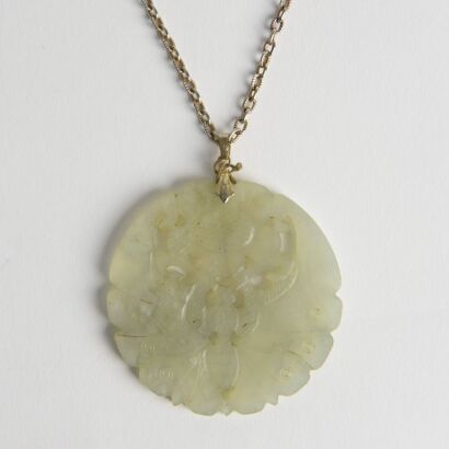 A Chinese Carved Jade 'Flower and Butterfly' Pendant