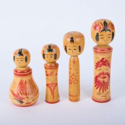 A Set of Four Kokeshi Dolls
