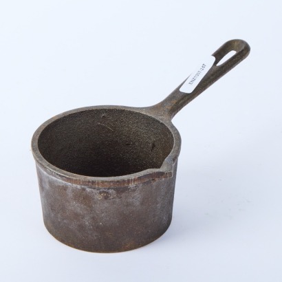A Lodge Cast Iron Melting Pot