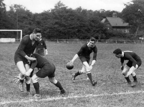 NZ Rugby League Team in training, Len Mason & Craddock Dufty (left) practice a tackle.