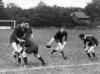 NZ Rugby League Team in training, Len Mason & Craddock Dufty (left) practice a tackle.