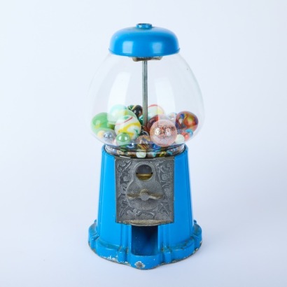 A Vintage Gumball Machine with Marbles