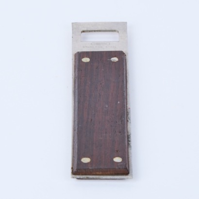 A Mid-Century Walnut and Stainless Steel Bottle Opener