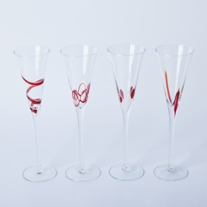 A Set of Four Handblown Flutes with Red Accents