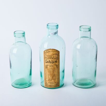 A Trio of Antique Glass Bottles Cast in Four Sections