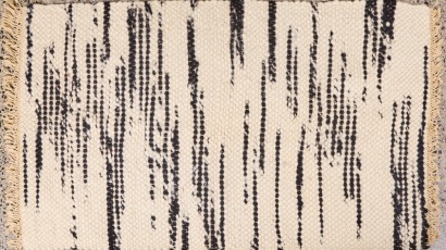 A Black and White Woolen Rug