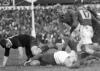 Number 17, C. B. Jennings of South watches as Arthur Lambourn (New Zealand) tackles an unidentified South Africa player