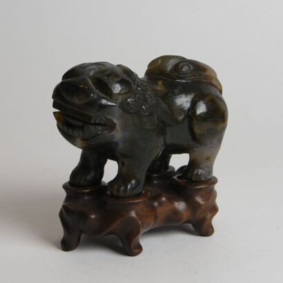 A Chinese Carved Jade Lion Ornament (Original Wood Stand)