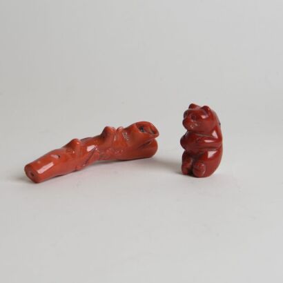 A Set of Two Chinese Carved Coral Ornaments