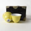 A Pair of Chinese Yellow-glazed Teacups (Jianguo Porcelain Factory Mark)