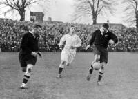 Freddie Allen (Kiwi five-eight) kicks in field having received the ball from H.E. Cook (full-back)