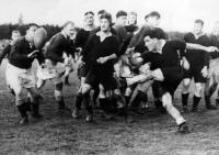 Dr. M.N. Paewai (New Zealand Māori half-back) kicks for touch. D.C. Furness [Aust. NSW - hooker] is in the line of fire