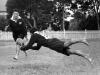 Māori Rugby Union players - Lawrence Frederick 'Laurie' Raureti (half-back) dives to pass to Manuera Ben Riwai Couch