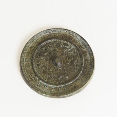 A Chinese Bronze 'Mythical Beasts' Mirror